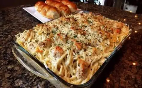 Creamy Chicken Tetrazzini casserole served in a baking dish with pasta and chicken.