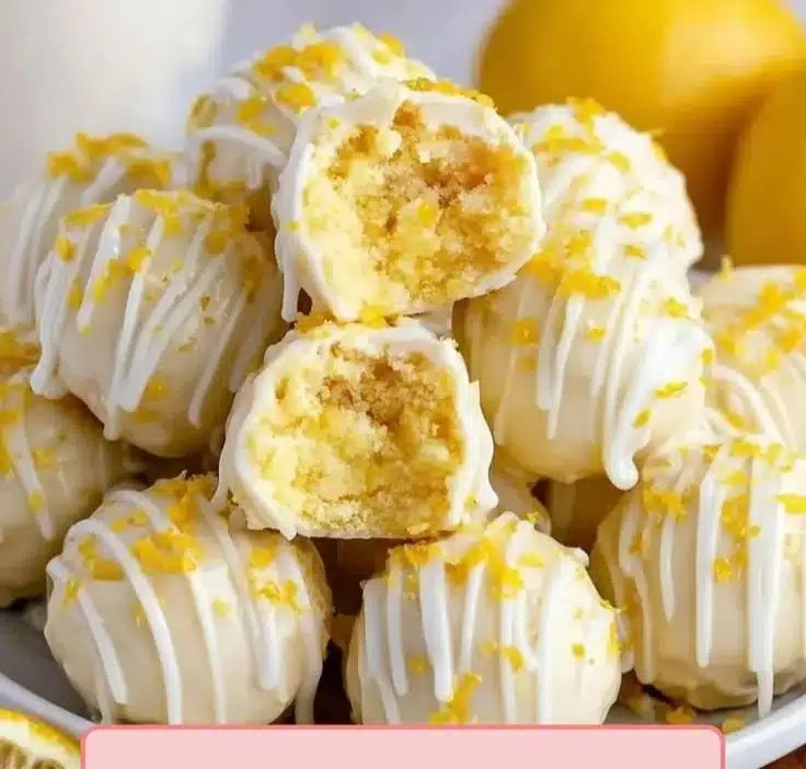 No-bake lemon cheesecake bites with a citrusy topping in a white dessert dish