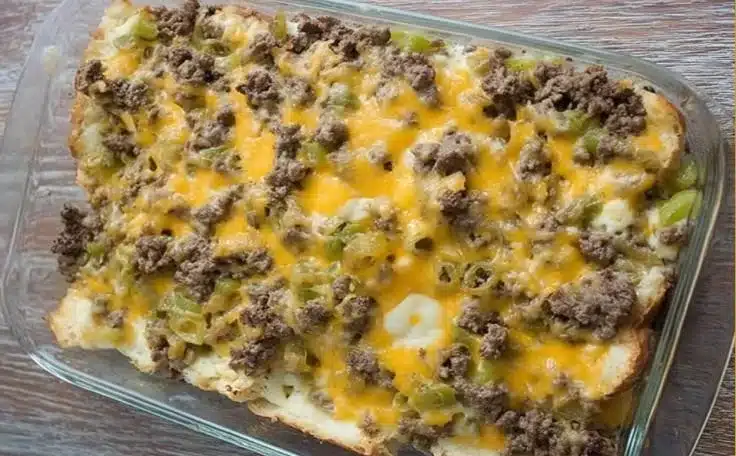 Delicious Philly Cheese Steak Casserole topped with melted cheese and veggies