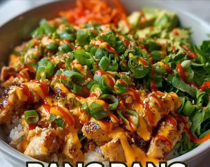 Delicious Bang Bang Chicken Bowl served with vibrant vegetables and sauce.