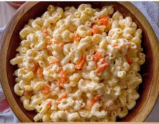 Bowl of authentic Hawaiian macaroni salad with colorful vegetables and creamy dressing.