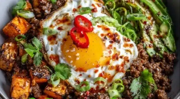 High Protein Hot Honey Beef Bowl with colorful vegetables and spicy sauce