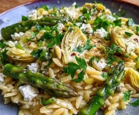 Colorful Mediterranean Orzo Salad with fresh vegetables and herbs