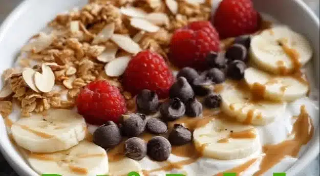 A vibrant protein packed yogurt bowl topped with fresh fruits and nuts