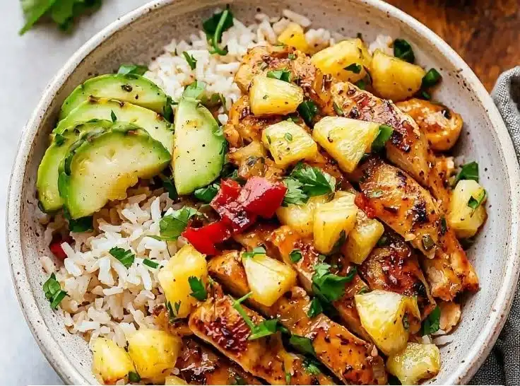 Delicious pineapple chicken served with rice on a plate