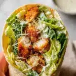 Crispy Chicken Caesar Wrap with romaine lettuce and parmesan cheese