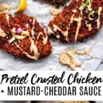 Crispy pretzel crusted chicken drizzled with cheddar-mustard sauce on a plate.