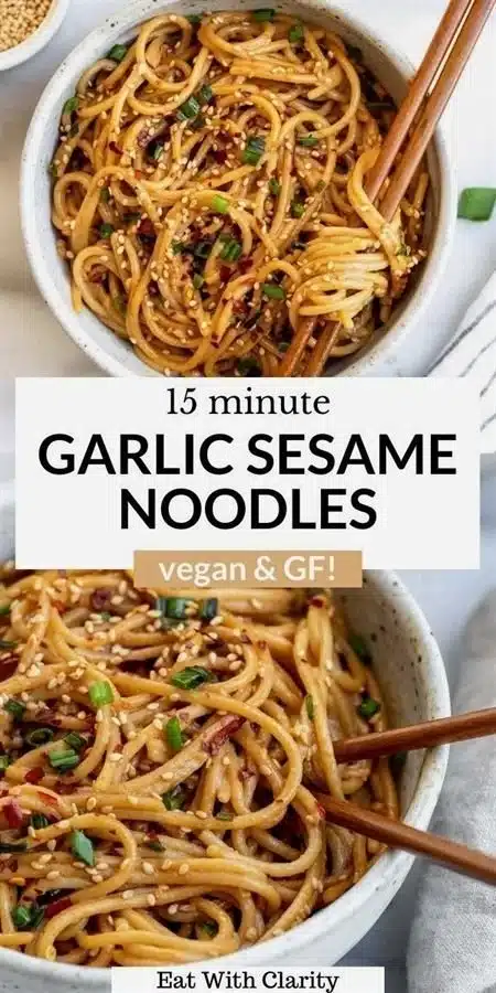 A bowl of Garlic Sesame Noodles garnished with green onions and sesame seeds.