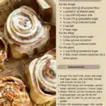 Freshly baked homemade cinnamon rolls with icing and cinnamon topping